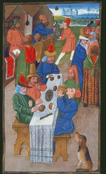 Bauern nehmen eine mittelalterliche Mahlzeit zu sich.